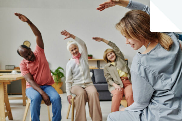 w women instructing elderly people to stretch